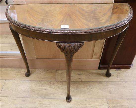 A 1930s D shaped side table W.88cm